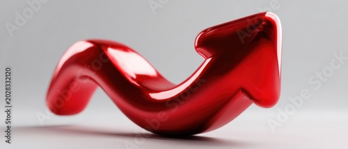 Red glossy three dimensional twisted arrow sculpture on light gray