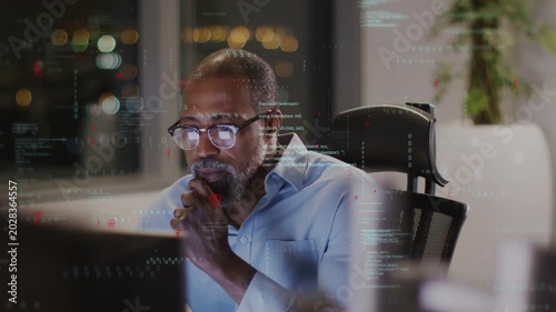 Senior dev leaning and studying code onscreen overlay updating hand moving typing and debugging
