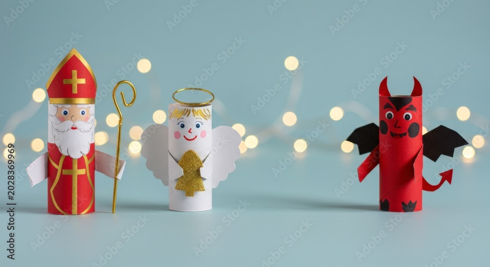 Fototapeta premium Handmade Saint Nicholas angel and devil Christmas craft figures.