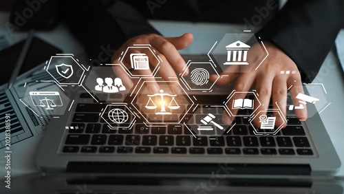 Photos Business professional using modern technology with digital icons representing law, security, communication, and data management in an office environment Gluon
