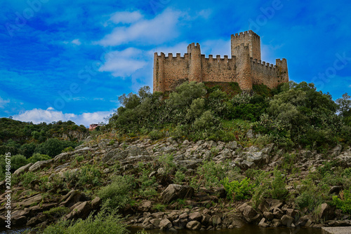 Fotografie Ancient Stone Castle Overlooking a Portuguese River