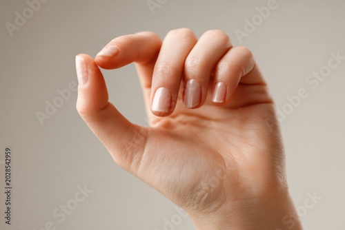 Woman's Hand Gesturing with Well-Manicured Nails