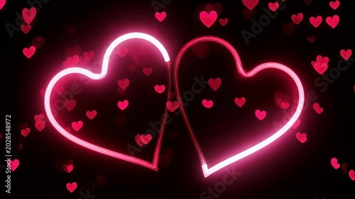 Glowing neon heart shapes on dark background. Symbol of love and romance for Valentines day. Bright pink light animation design for holiday celebration theme.