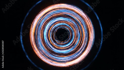 Hypnotic Blue and Orange Light Trails Spinning in a Mesmerizing Circular Motion.