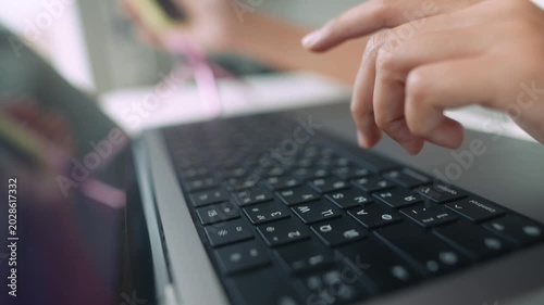 Concentrated programmer debugging software using laptop and keyboard