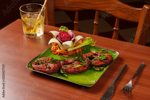 Tableau sur toile Tawa Fish Fry Indian Restaurant Style Spicy Seafood Dish