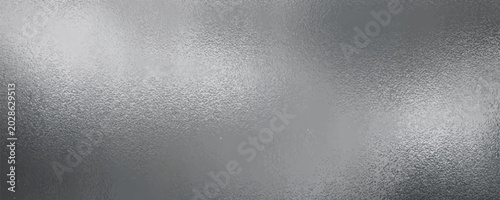 Foto Shiny silver foil metallic texture - glossy gray steel gleaming surface, frosted glass effect with blur glare reflection, bright polished metal material