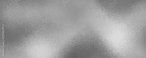 Photography Shiny silver foil metallic texture - glossy gray steel gleaming surface, frosted glass effect with blur glare reflection, bright polished metal material