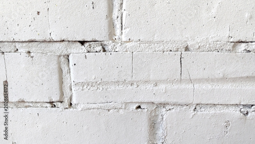 Valokuva White painted brick wall texture background, rough masonry surface, abstract construction pattern, urban architecture detail