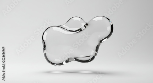 A transparent glass-like object floats in mid-air on a plain surface indoors.