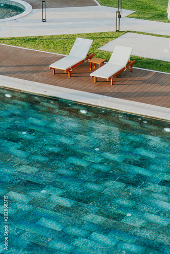 Luxury Swimming Pool Deck Lounge Chairs Modern Resort Green Grass Overhead View