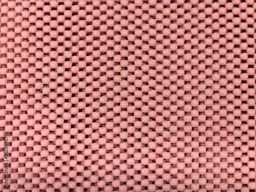 Fotografi Pink rubber non-slip mat texture with small raised round dots pattern