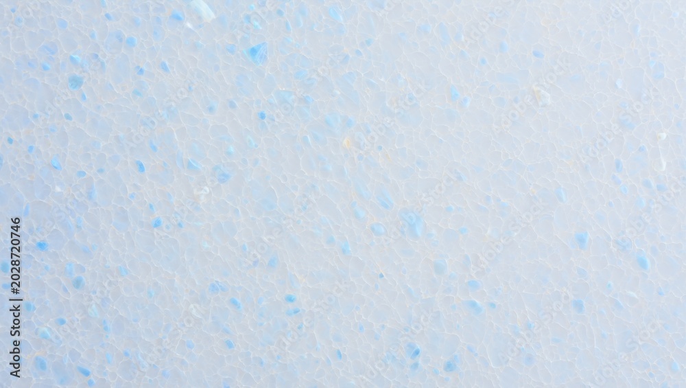 Fototapeta premium Porous blue and white texture forming a detailed abstract pattern on a light background for various design concepts