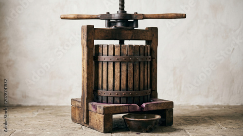 Old-fashioned wooden wine press in rustic setting for Wine Day  