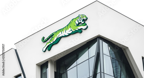 Green dragon on white building facade with glass windows