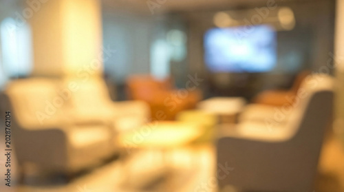 Blurred warmly lit home living space with ambient lighting and modern decor