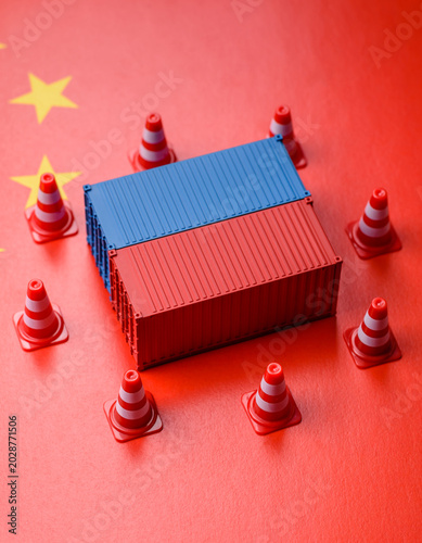 Canvas Print The cargo container ban on the China flag as a conceptual backdrop