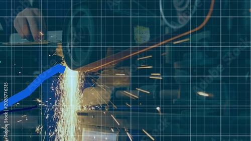 Disc contacting metal, grinder sending sparks while blue charts rising on grid showing output