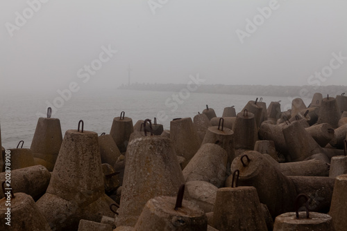 Photos Foggy harbor with concrete tetrapods