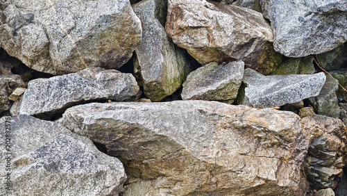 Quadro su tela Pile of textured rocks and stones close up