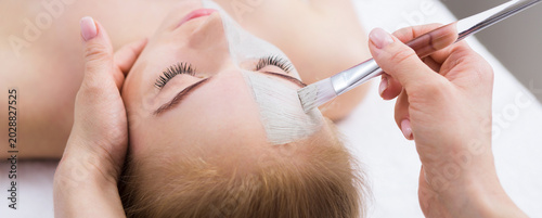 Konstfotografi A woman lies on a treatment table in a beauty salon