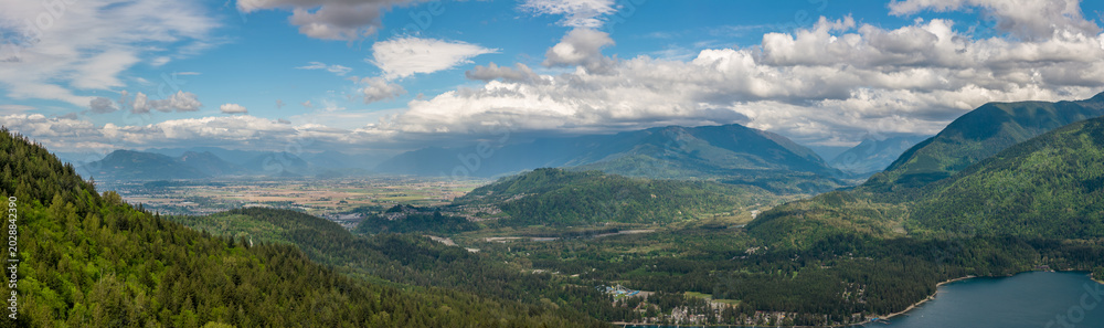 Fototapeta premium Panoramic Mountain Valley Overlooking Chilliwack Farmland and Lake in British Columbia, Canada