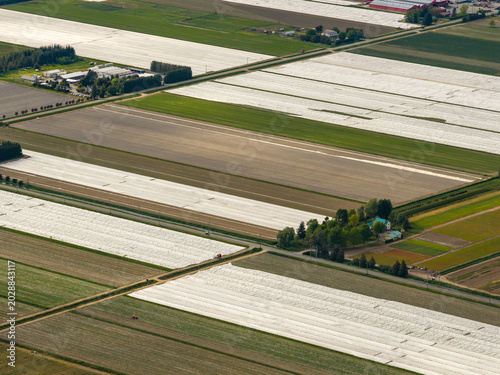 Photos Aerial Farmland With Covered Fields, Tractors and Rural Landscape Near Chilliwac