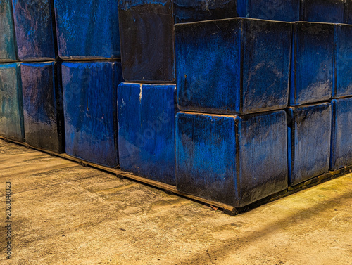 Garden planters painted with blue ceramic glaze and featuring a glossy finish