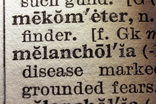 Konstfotografi Word melancholia on dictionary page, macro close up