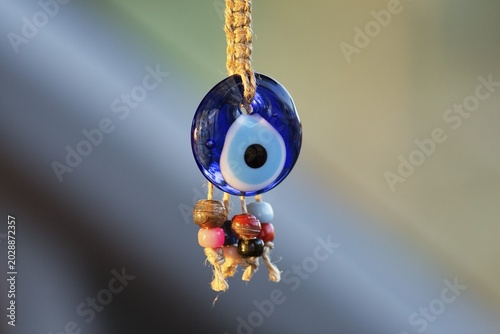 Eye of Fatima, Nazar, Boncuk, blue glass bead, amulet against the evil eye hangs on cord, decoration