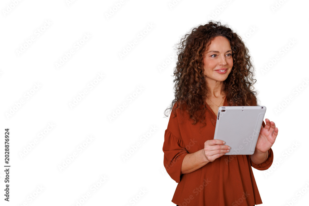 Naklejka premium Professional woman with curly hair smiling and holding a tablet, communicating with technology, transparent background