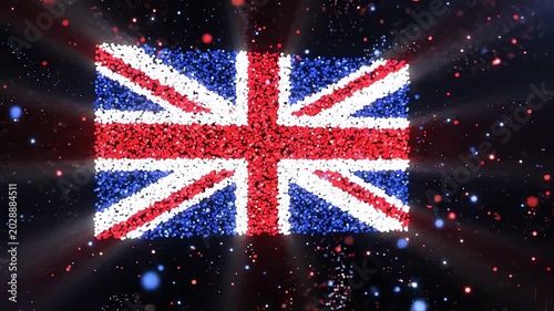 Festive Particle Fireworks Exploding to Reveal British Flag with Glowing Light Rays on Black Background