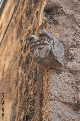 Фотография Ancient medieval stone carved coat of arms heraldic relief sculpture vertical view