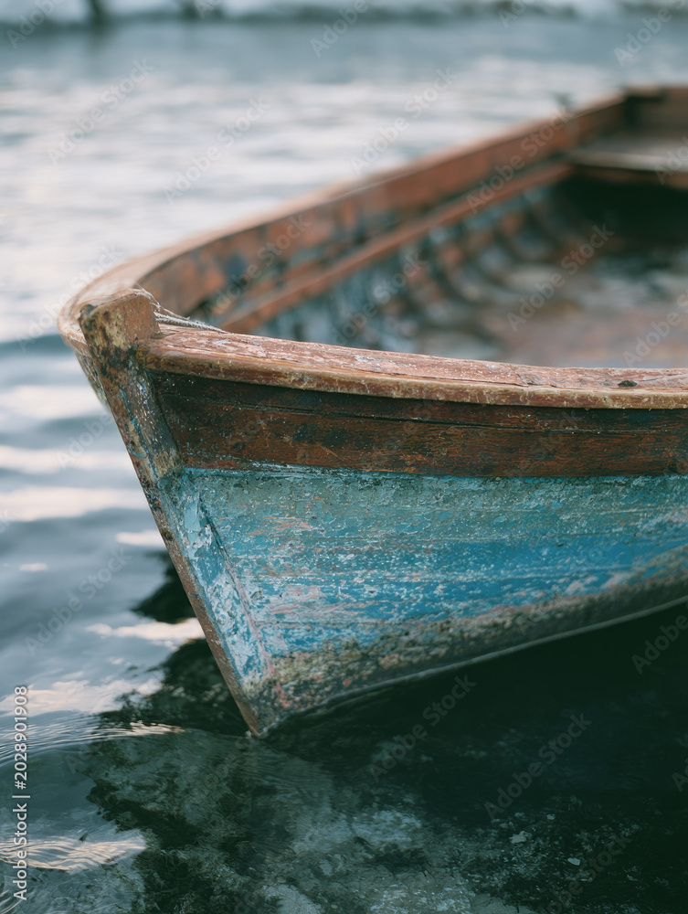 Fototapeta premium Wooden boat harbor dusk weathered hull moored closeup