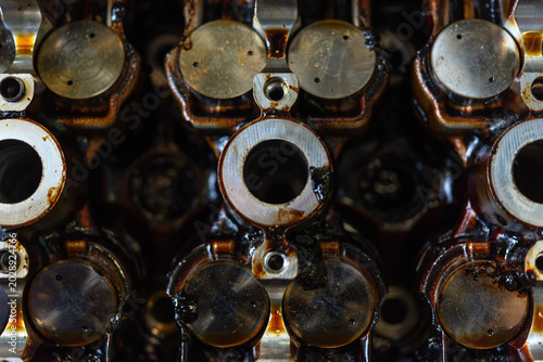 Obraz na plátně Closeup of engine valve assembly oil residue highlighting automotive maintenance