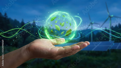 Hand Holding Glowing Green Energy Sphere with Renewable Energy Farm