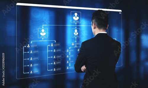 Quadro em tela Businessman Analyzing Data Flow on Interactive Digital Screen with User Profiles