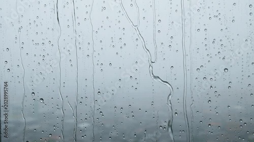 Rain droplets on glass wall	