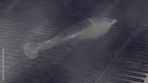Army projectile missile. Military projectile. Military mortar shells on floor. Ammunition. Bombs. Artillery rounds on dark floor. Amy mortar shells. Rusty artillery shells. Army Mine. Projectile.