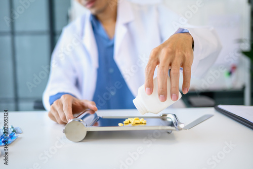 Pharmacist preparing medication counting pills for customer service in pharmacy