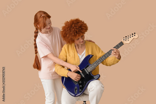 Young happy woman giving el...