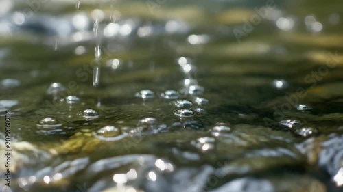 Water Droplets on Surface Tension Ripples.