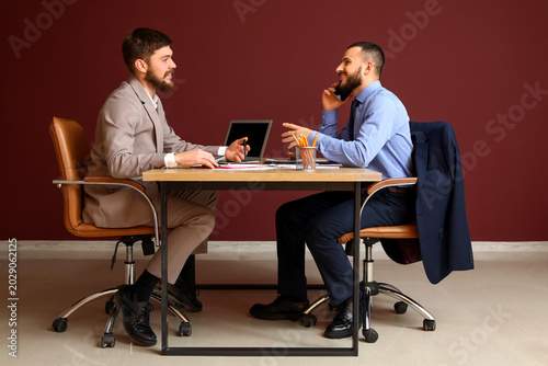 Happy businessmen talking b...