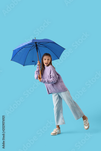 Cute teenage girl with blue...