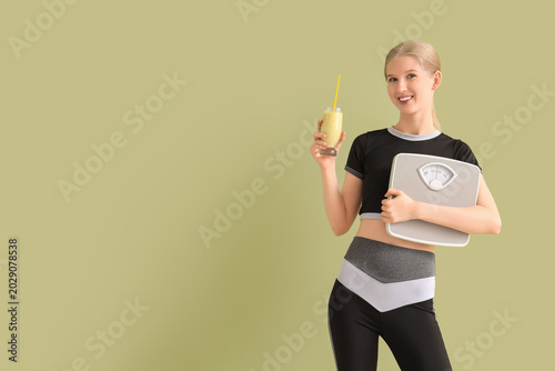 Happy sporty young woman wi...