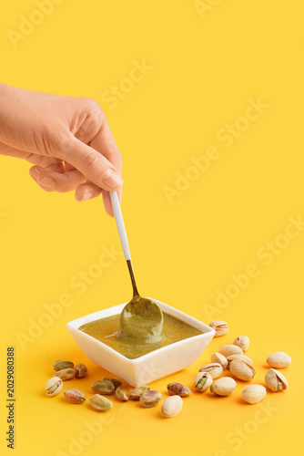 Female hand with spoon and ...
