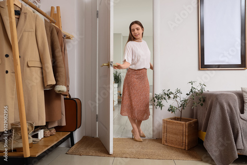 Young woman walking through...