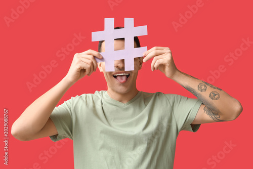 Funny young man with hashta...