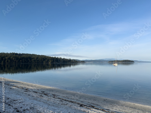 Sailboat anchored in a tranquil bay in the Gulf Islands