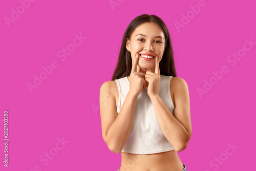 Smiling young Asian woman w...
